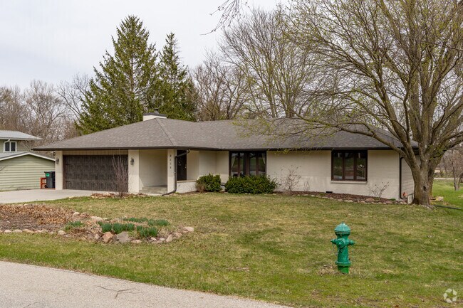On Timberland Road itself, midcentury ranch homes can be found nestled in wooded lots.