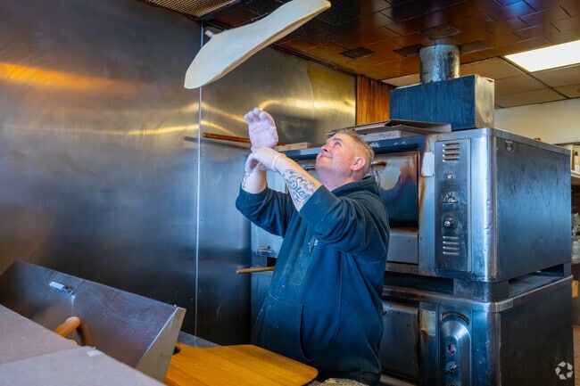 Stand at the counter and watch Keith prepare a pie at Belmont Pizza in Waverley Square.