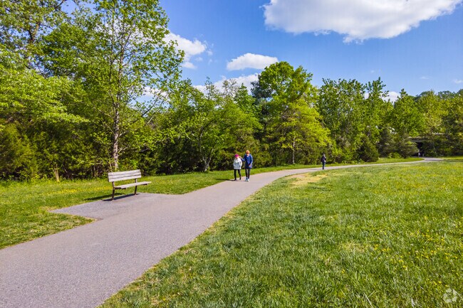Residents enjoy a beautiful spring day on Sligo Creek Park's walking trail in nearby Forest Estates.