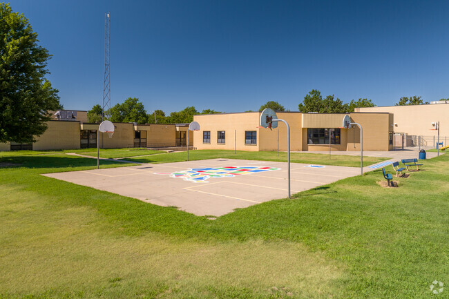 There is an outdoor basketball court at Peterson Elementary School.