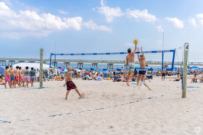 Spike, set, and score some fun at the beach volleyball courts near Deerfield Beach.