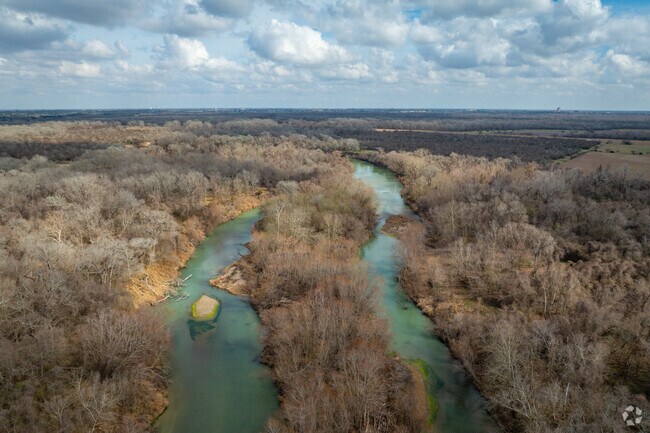 During heavy rainfall, the Guadalupe River floods, leaving homes surrounding it vulnerable.