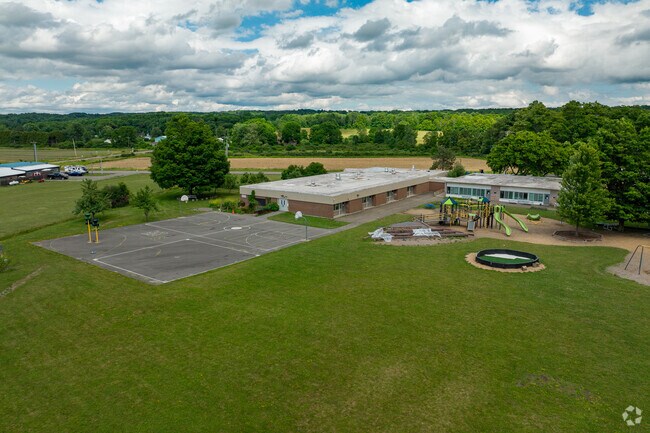 Enfield School has a wide open green space for student activities.