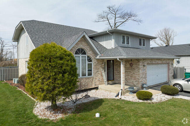 One of many charming homes nested in the quaint Phoenix, IL area.