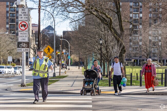 A crossing guard will help you get across the street during the busy hours in Northside.