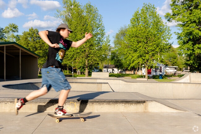 Skaters can be seen practicing tricks and popping ollies at the Sheridan Skate Park.