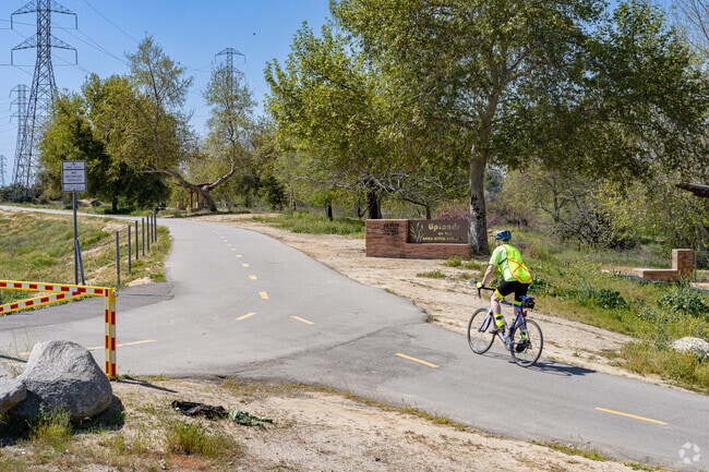 Bicyclists enjoy miles of paved trails along the Kern River in Homaker Park.