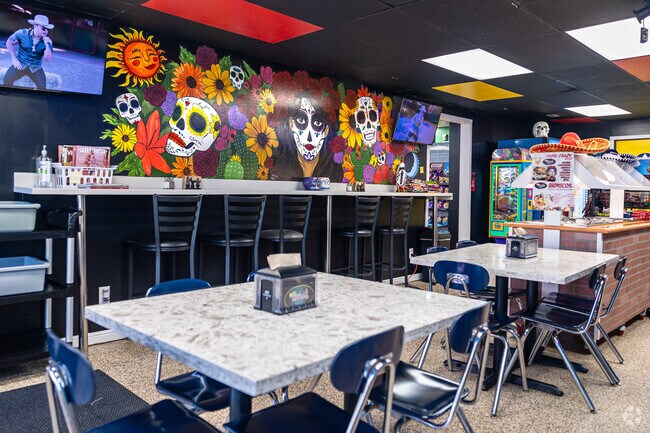 Colorful Day of the Dead art adorns the interior of No Manches Way Mexican food.