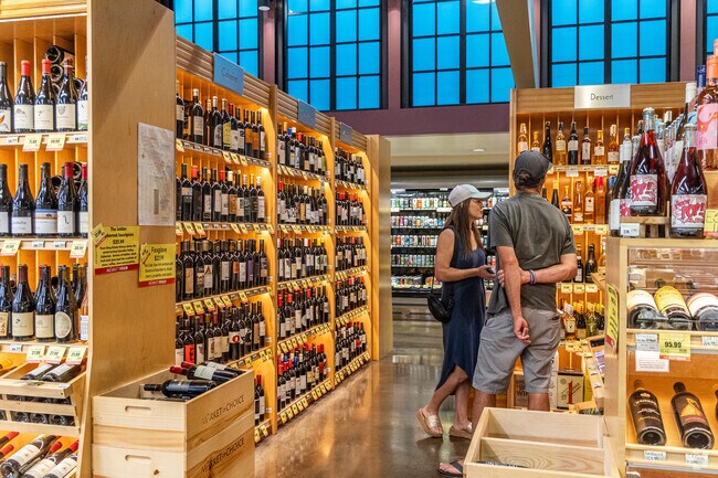 Grocery shoppers in Bolton shop at the upscale Market of Choice.