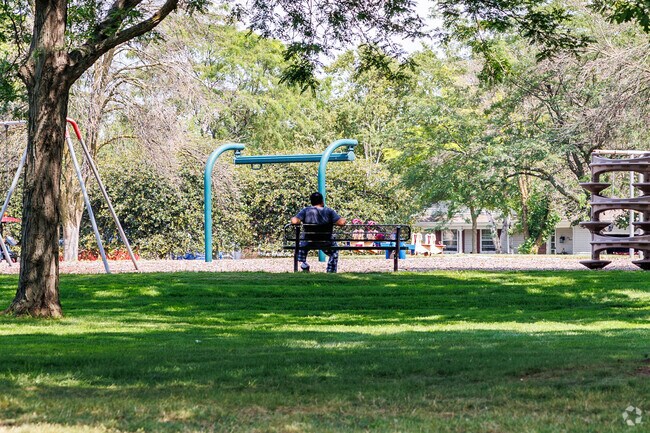 With park benches throughout Colony Oaks Park visitors can sit and enjoy the outdoors.