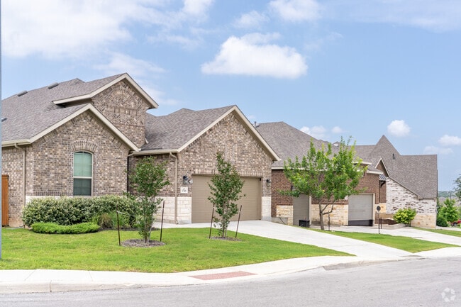 Rows of modern homes in Fronterra at Westpointe offer spacious front and backyards designed for relaxation and outdoor gatherings.