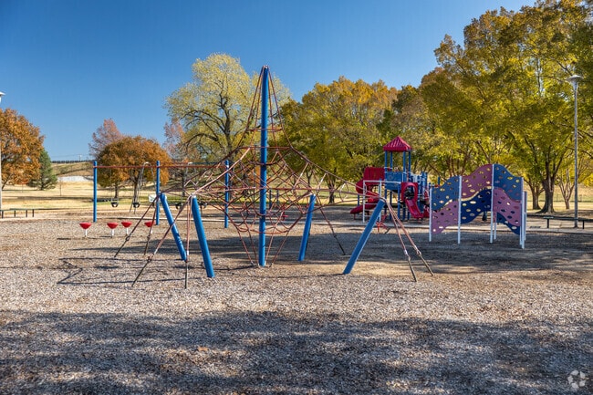 Kids can climb on the playground at Cessna Park near Meadowlark.