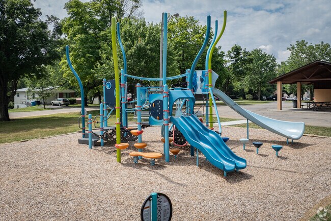 Kids enjoy the blue playground with their friends at East Gate Park.