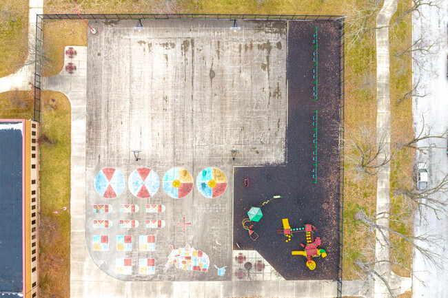 Thomas J Jefferson Elementary School features a large blacktop and playground.