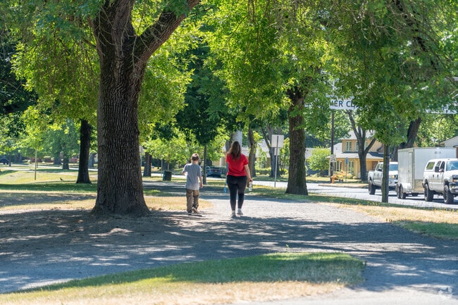 Saint Helens neighborhood offers peaceful tree-lined streets perfect for a relaxing walk.