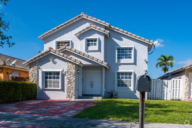 Brightly painted homes add color to streets in Kendale Lakes West.