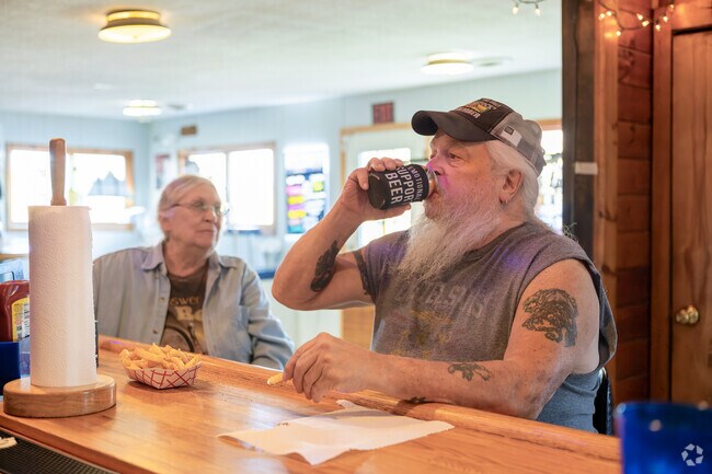 Beachcomber features a lakeside bar and seasonal crowd on Conesus Lake.