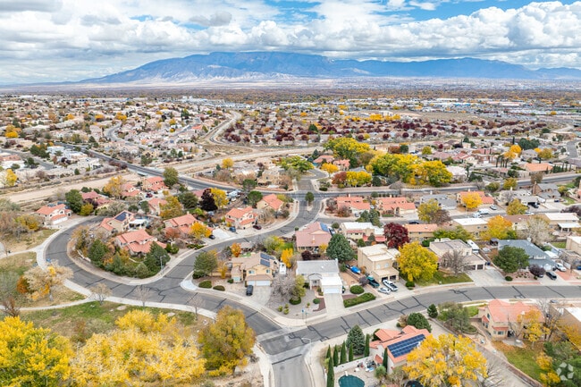 Homes line quiet subdivision streets with panoramic views of the New Mexico countryside.