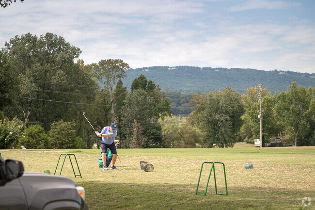 A local works through his swings at Moccasin Bend Golf Course.