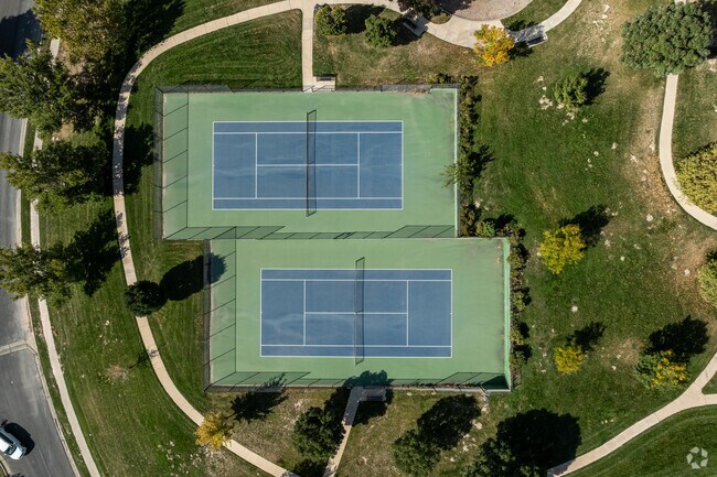 Tennis courts are surrounded by walking paths at Ensign Downs Park in Capitol Hill.
