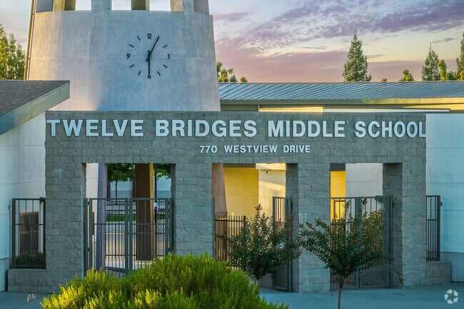 Sun glows off the Twelve Bridges Middle School entrance at sunset.