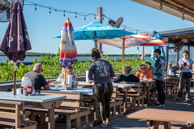 Bethune Beach residents enjoy the catch of the day along the Indian River at JB's Fish Camp.