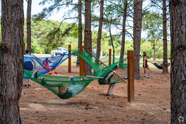 Lounging in the hammocks at Dorothea Dix Park is a popular pastime for Caraleigh residents.