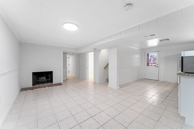 Large living room with decorative fireplace!