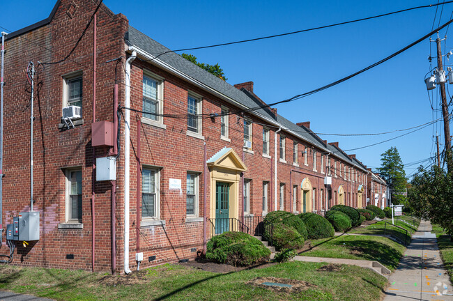 A row of colonial style multi unit condos on 10th St NE near Catholic University.