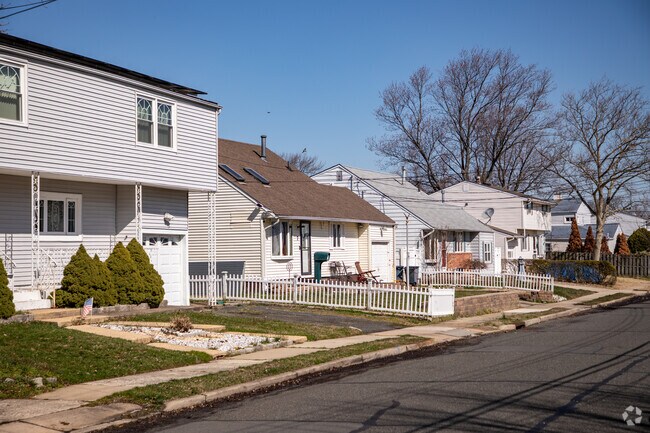 Two story homes sit along quiet tree lined streets in Union Beach.