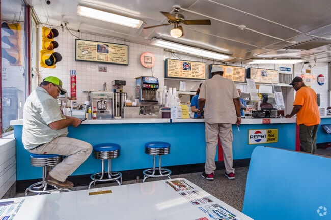Kermit's Drive-In has a mid-1900s vibe with barstools and booths.