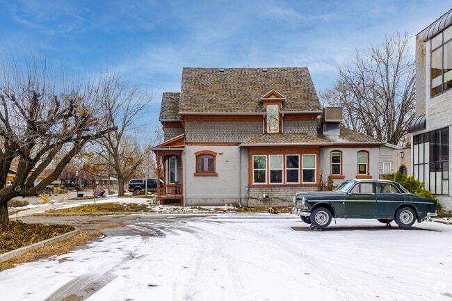 Classic style home with a classic car in the driveway.