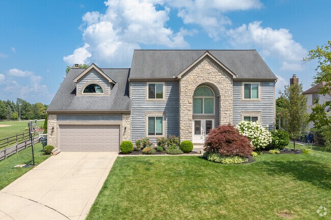 Traditional two-story homes in Worthingview often include attached two-car garages.