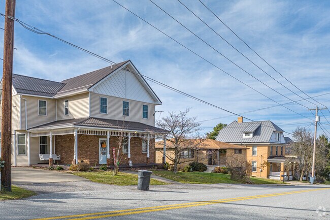 A row of different-style homes sits along a road in Mount Pleasant Township.