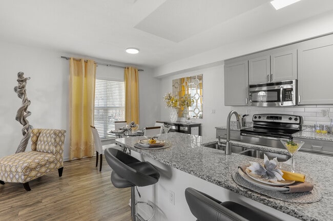 Renovated I Kitchen and dining area with hard-surface vinyl plank flooring