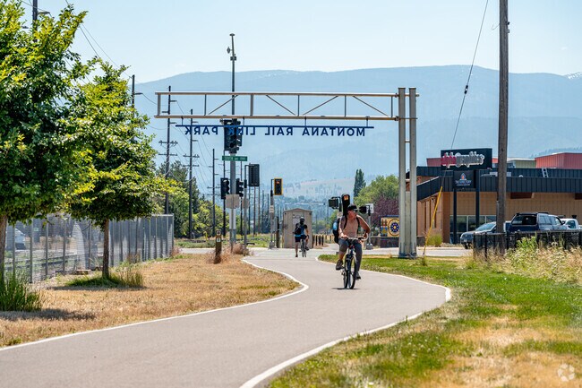 Southgate Triangle locals stroll through the town on the Bitterroot Trail.