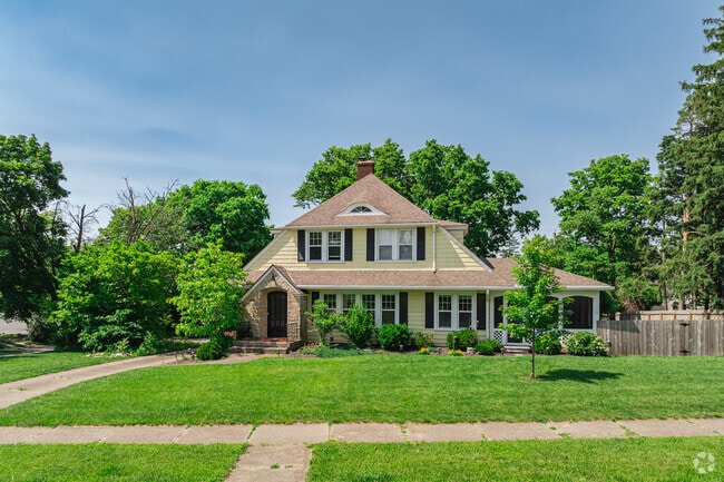 Some homes in the area include decorative shutters and symmetrical facades, drawing from Colonial Revival influences.
