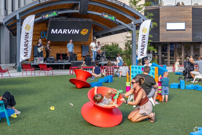 Your children will love playing on the grassy area at Music in the Park in downtown Fargo.