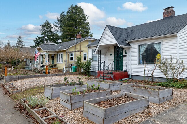 Single family homes with garden boxes in front at Arbor Lodge, Oregon.