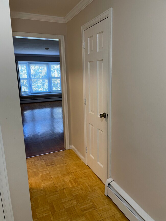 Entrance to Living Room, Half Bath Door on right