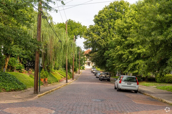 The InTown neighborhood still has several historic, brick covered streets with lush green foliage.