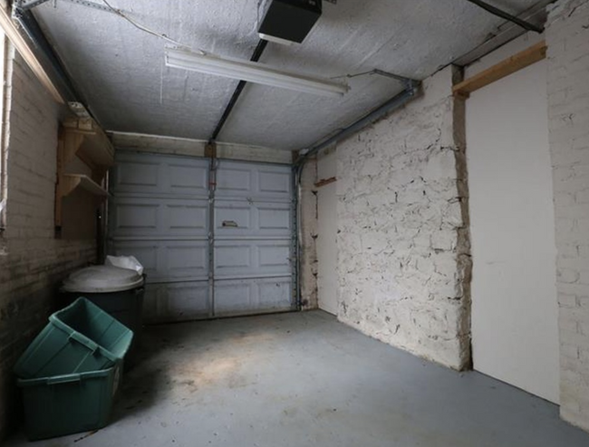 One car garage and unfinished basement room offers lots of extra storage