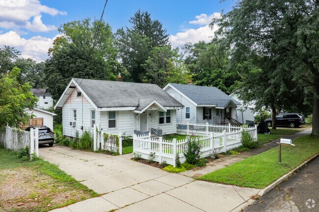 Discover quaint cottages with white picket fences and paved driveways in North Central.