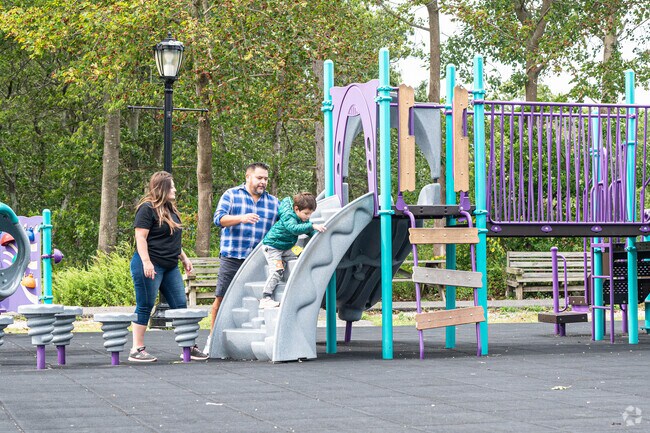 A family having fun together in the playground.