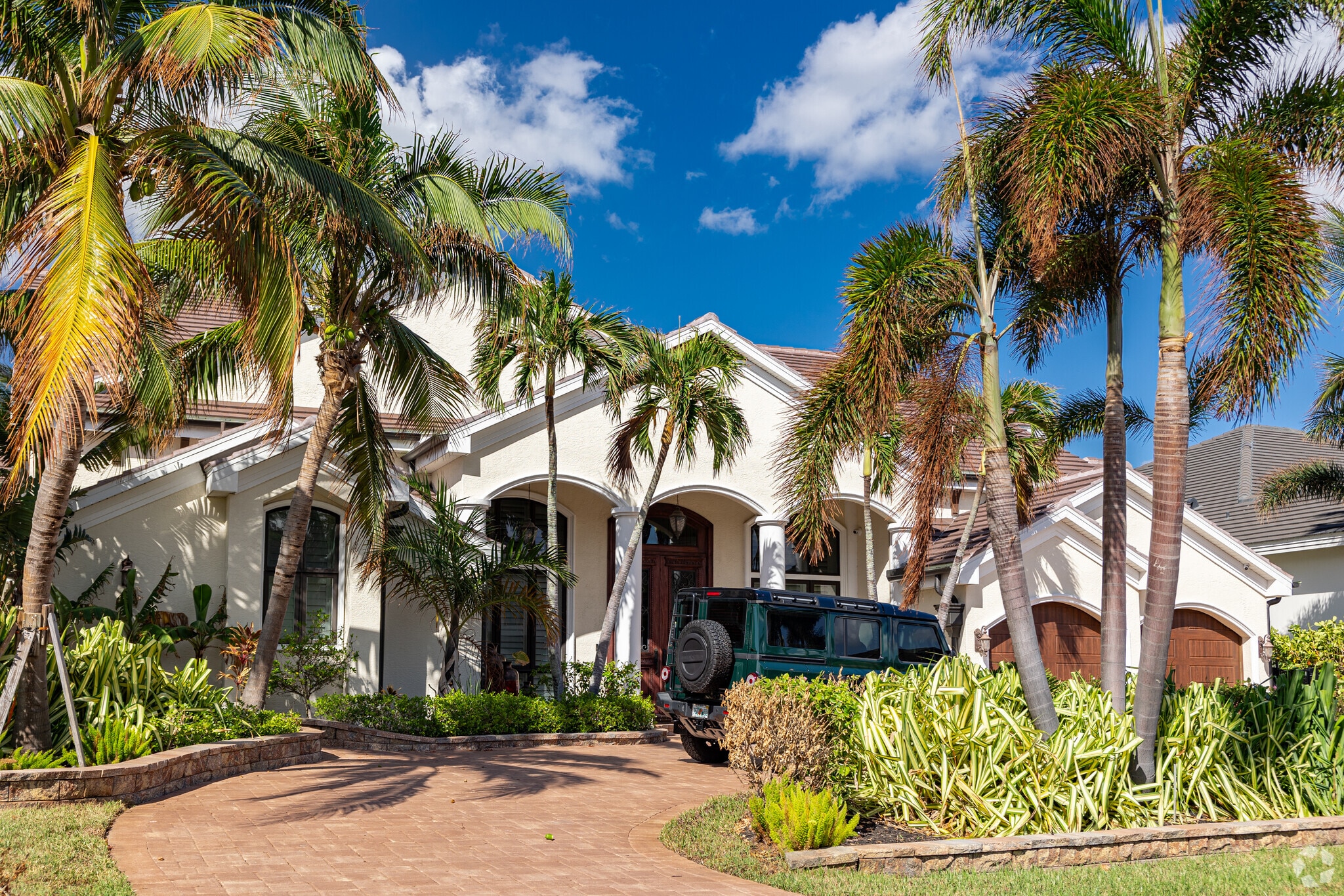 Coastal homes in Punta Gorda Isles feature decorative landscaping and updated designs.