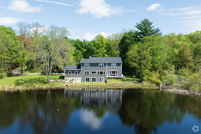 This stunning Lippitt Estates home offers peaceful lake views right from your doorstep.