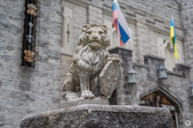 Lion statue guarding the Pax Amicus Castle Theatre in Budd Lake