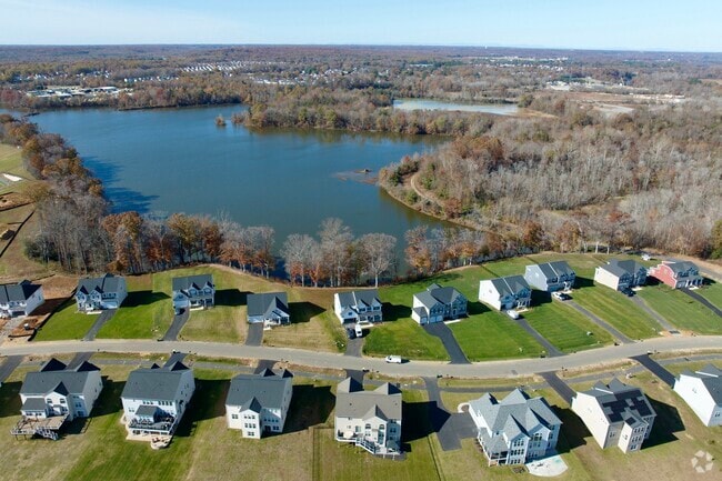 Some New Post homes back up to a scenic lake.