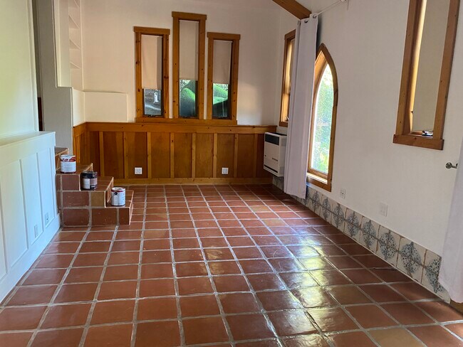 All tile floors. Was chapel for Krotona society.