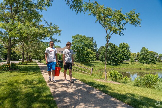 Friends enjoy the outdoors, while taking a brisk walk through Clow Creek Greenway.